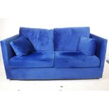 A Made 'Milner' two seater sofa bed in blue velvet