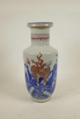 A Chinese blue and white porcelain Rouleau porcelain bottle vase decorated with red kylin in a