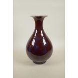 A Chinese flambe glazed pear shaped vase, 13½" high