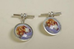 A pair of 925 silver cufflinks set with cold enamel plaques depicting dogs