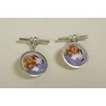 A pair of 925 silver cufflinks set with cold enamel plaques depicting dogs