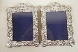 A pair of sterling silver photo frames, apertures 4" x 5½"