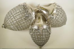 A set of three graduated acorn shaped glass and plated electric ceiling light fittings, largest