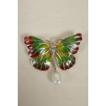 A silver and enamel butterfly pendant brooch with faux pearl drop, 2" wide