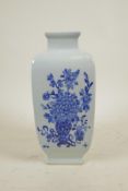A Chinese blue and white porcelain square shaped vase with decorative panels depicting objects of