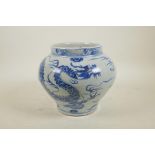 A Chinese Yuan style blue and white porcelain jar with dragon and flaming pearl decoration, 8" high,
