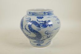 A Chinese Yuan style blue and white porcelain jar with dragon and flaming pearl decoration, 8" high,