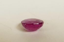 A 4.90ct translucent natural ruby, oval cut, glass filled, colour enhanced, certified, with