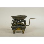 An early Chinese gilt bronze medicinal burner decorated with mythical creatures, 6½" long, 4½" high