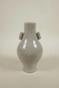 A Chinese crackle glazed porcelain vase with two lug handles, seal mark to base, 9" high