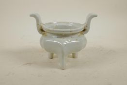 A Chinese white glazed porcelain censer with two handles and tripod supports, 5" high