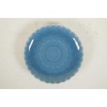 A Chinese teal blue glazed porcelain dish in the form of a flower, seal mark to base, 8" diameter