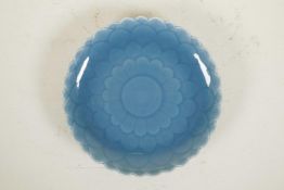 A Chinese teal blue glazed porcelain dish in the form of a flower, seal mark to base, 8" diameter