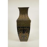 A Chinese mottled green glaze pottery vase with two lion mask handles, gilt and black banded archaic