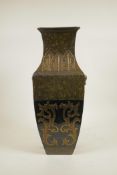 A Chinese mottled green glaze pottery vase with two lion mask handles, gilt and black banded archaic