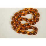 A long faux amber bead necklace, 34" long