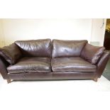 A Marks and Spencer brown leather two seater sofa, 84" wide