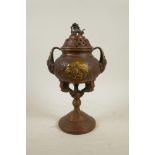 A large Oriental coppered bronze incense burner and cover with two handles and fo dog knop, 13" high