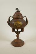 A large Oriental coppered bronze incense burner and cover with two handles and fo dog knop, 13" high