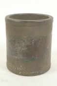 A Chinese iron brush pot engraved with figures and animals in a continuous landscape, 4" high, 4