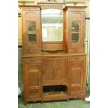 A Dutch Art Nouveau oak mirror back sideboard in two sections with carved pear tree decoration and
