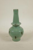 An Oriental celadon glazed porcelain vase with treacle splash glaze, 8½" high