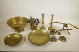 A good collection of assorted brassware to include a pair of ejector candlesticks, Chinese bowls,