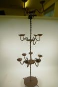 A wrought iron fifteen branch standing candlestick with twisted stem, A/F, 45" high