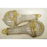 A pair of glass and gilt metal wall lights of classical style, 27" long