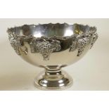 A large chrome plated pedestal punch bowl decorated with cast bunches of grapes, 10" high, 15"