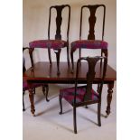 A Victorian style mahogany dining table raised on fluted supports (detachable), and a set of Queen