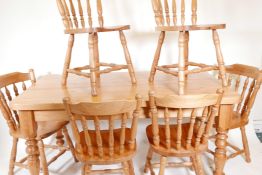 A pine scullery table and six matching spindle back chairs, 59½" x 33½", 31" high, with detachable