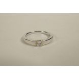 A white gold single stone princess cut diamond ring, approximate size 'M/N'