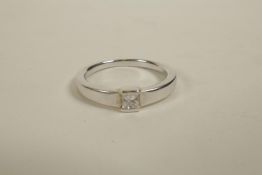 A white gold single stone princess cut diamond ring, approximate size 'M/N'