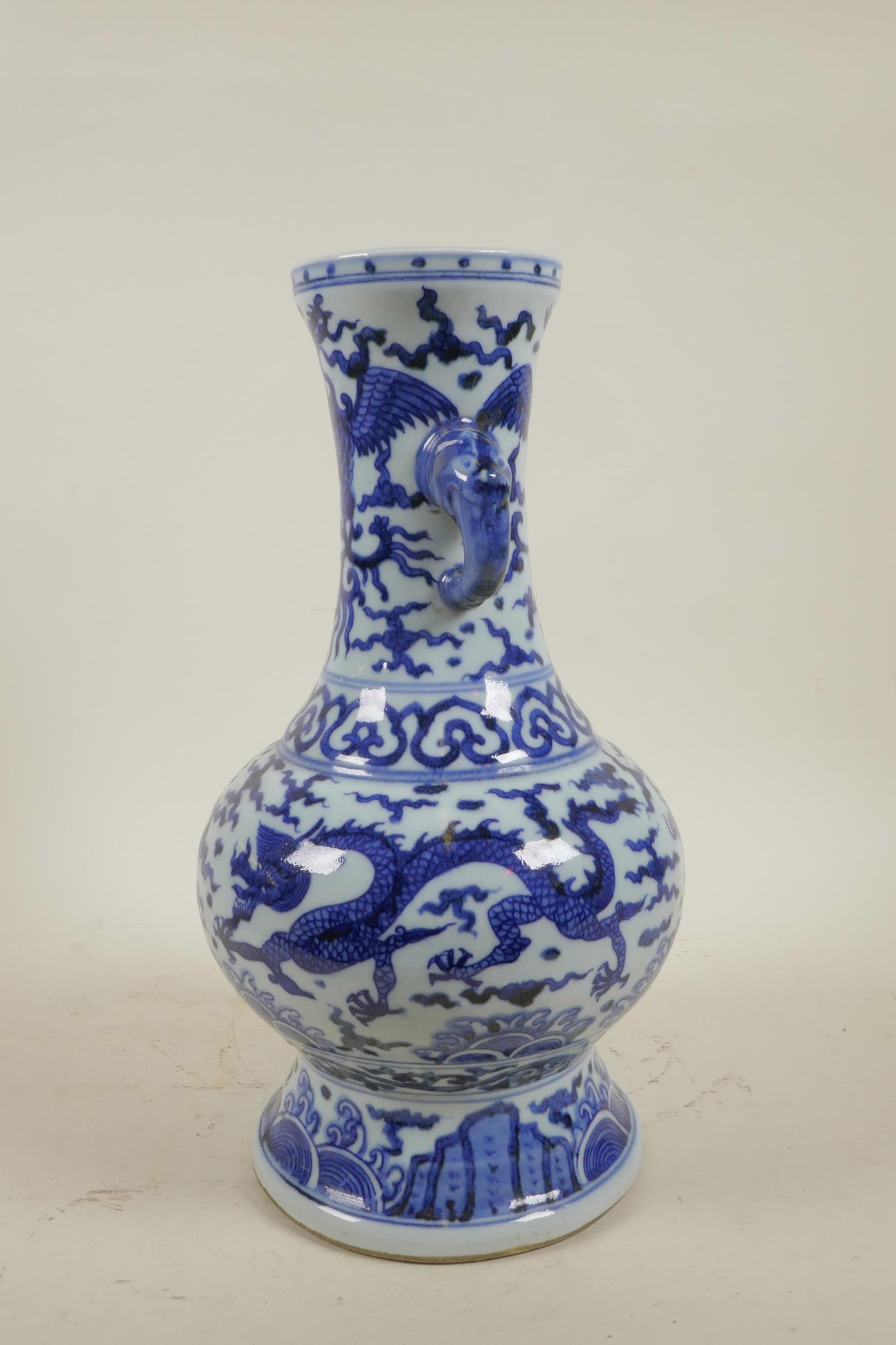 A Chinese Ming style blue and white porcelain two handled vase decorated with dragons and phoenix, 6 - Image 4 of 5