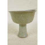 A Chinese celadon glazed porcelain stem cup with leaf pattern decoration, 4¼" high