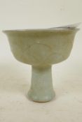 A Chinese celadon glazed porcelain stem cup with leaf pattern decoration, 4¼" high