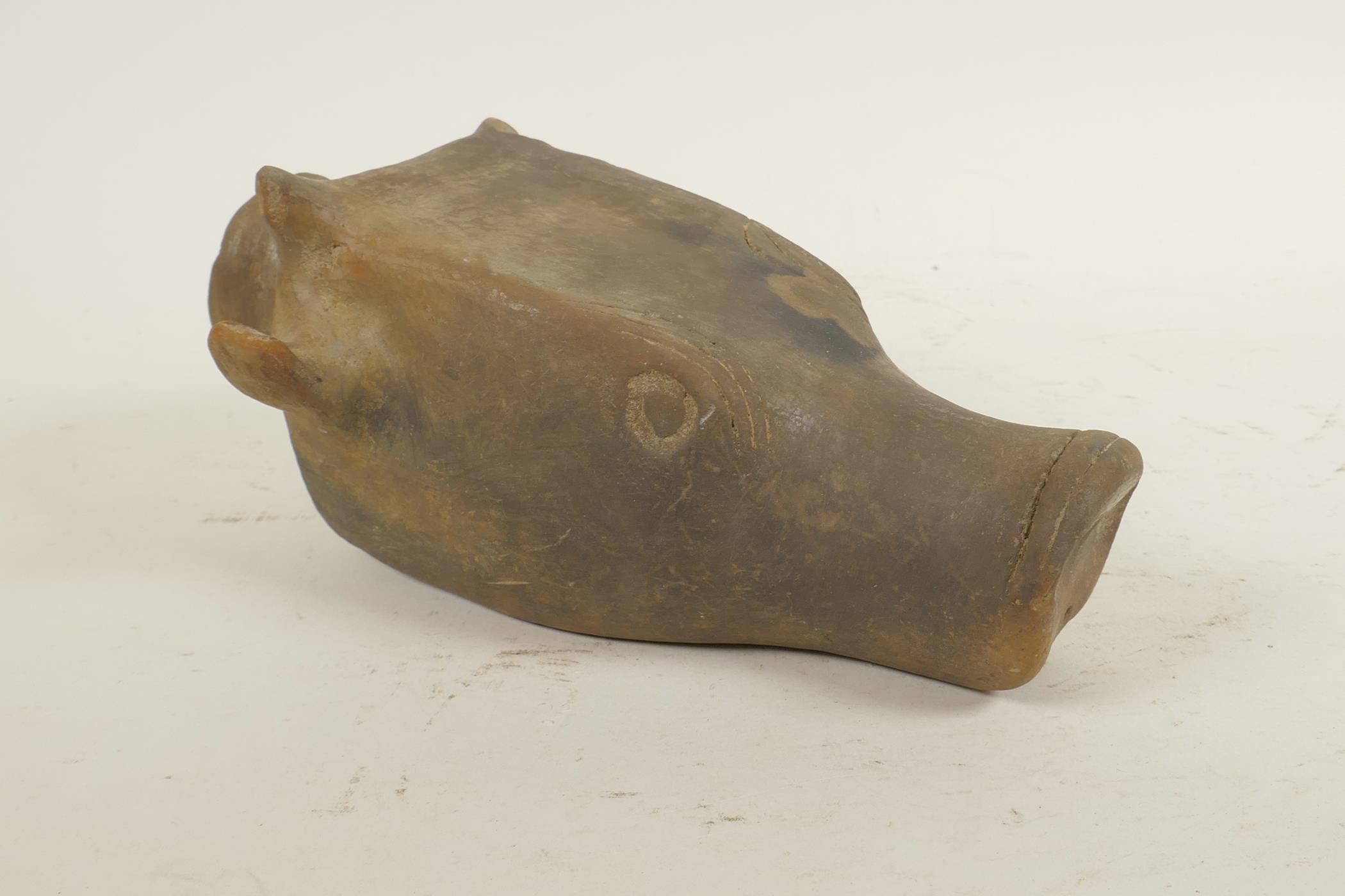 An Indo-Persian terracotta rhyton in the form of a deer head, 8" long, A/F