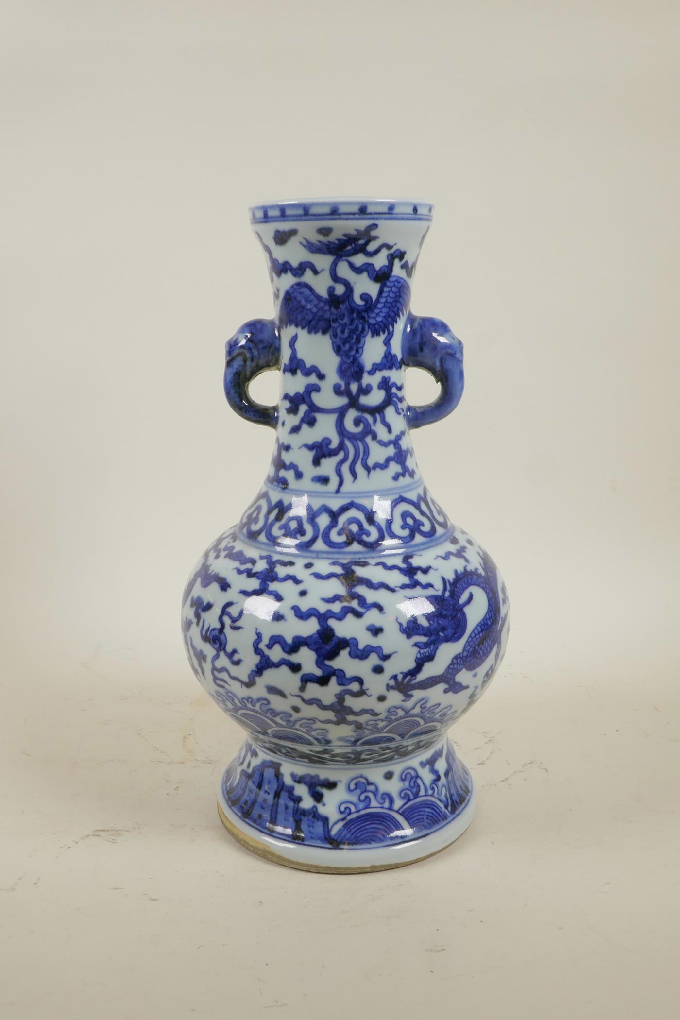 A Chinese Ming style blue and white porcelain two handled vase decorated with dragons and phoenix, 6 - Image 3 of 5