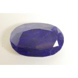 A 304ct natural blue sapphire, oval mixed cut, colour enhanced, certified by Gemological