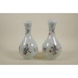 A pair of Chinese polychrome porcelain garlic head shaped vases decorated with four Immortals,