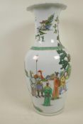 A Chinese famille verte porcelain vase decorated with figures in a landscape, 17" high