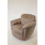 An Italian Natuzzi Gratitudine C163 swivel glider chair in brown suede