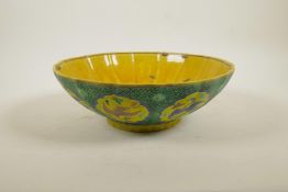 A Chinese Sancai glazed porcelain bowl of lobed lotus flower form decorated with cranes, character