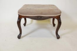 An early C19th cabriole legged stool with carved floral decoration and tapestry upholstery, 24" x