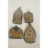 Four unusual Tibetan Buddhist pendants, largest 3" long