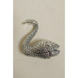 A sterling silver brooch in the form of a swan, 1½" high