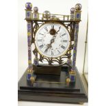 A Rolling Ball clock in brass and glass case, 16" high, 10" square