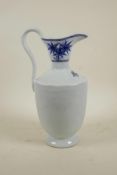 A Chinese blue and white porcelain jug with incised auspicious fruit decoration, 2 character mark to