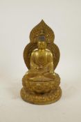 A Chinese gilt bronze figure of Buddha seated on a lotus throne, impressed 4 character mark to base,